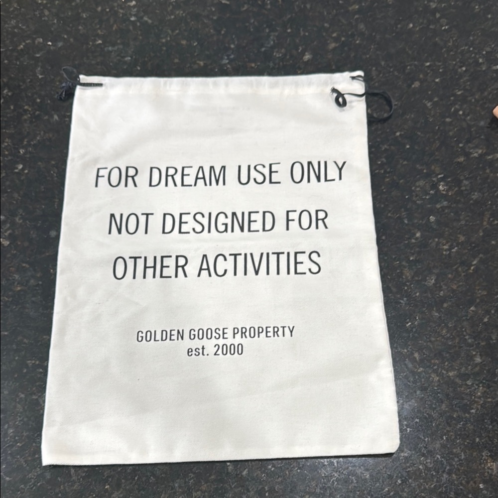 Golden Goose Cream Drawstring Bag with Black Text